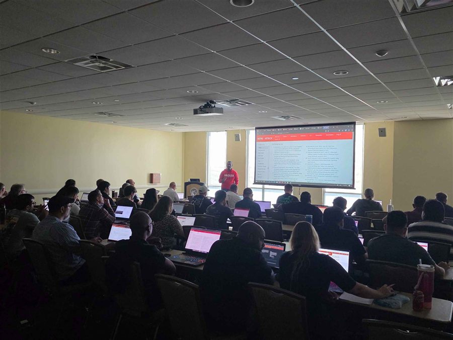 A full room at a BreachSimRange adversary emulation training, BSides Tampa 2025